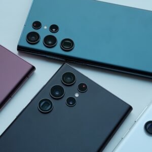 a group of four different colored cell phones